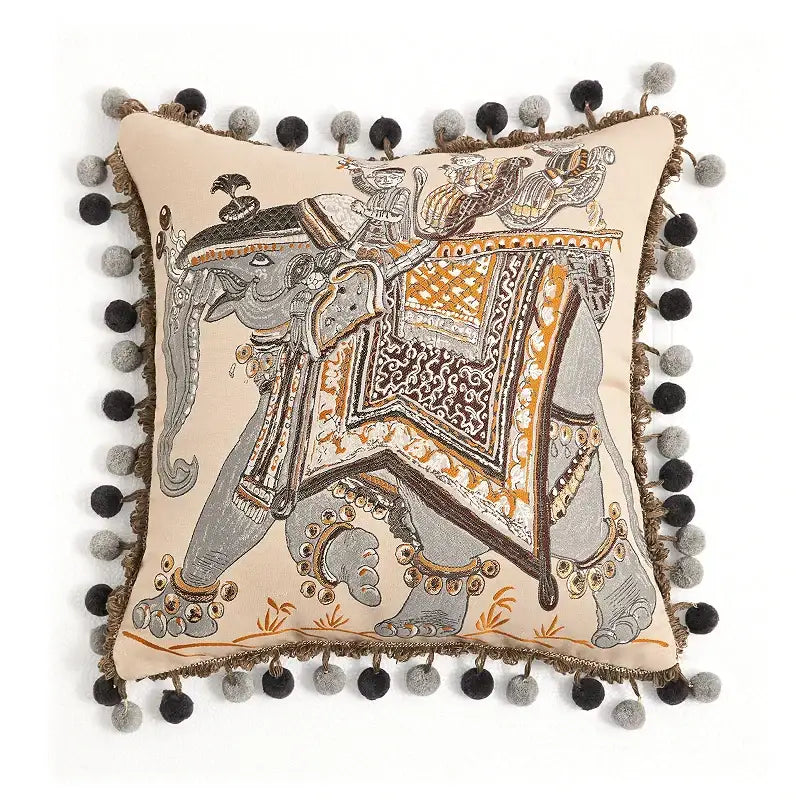 Beige cushion cover with embroidered elephant and black gray pom-poms by decorbites american luxe retro
