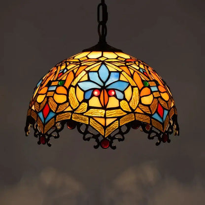 Retro Tiffany style colorful glass chandelier pendant light with vibrant floral stained glass and decorative black metal frame