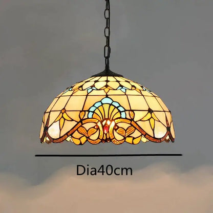 Retro tiffany style colorful glass chandelier with amber floral and shell patterns in a black metal frame by Decorbites colorful glass