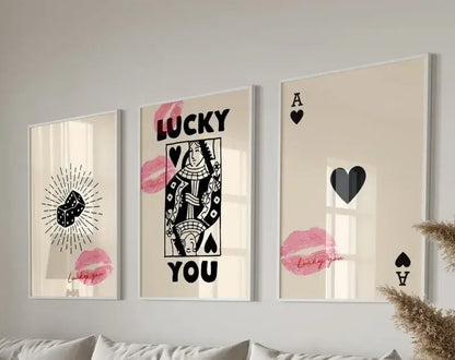 Three framed DecorBites™ retro wall art posters featuring black and pink poker-themed designs on cream background