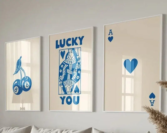 Three framed retro wall art pieces featuring blue playing card designs on cream background from DecorBites Lucky Queen set