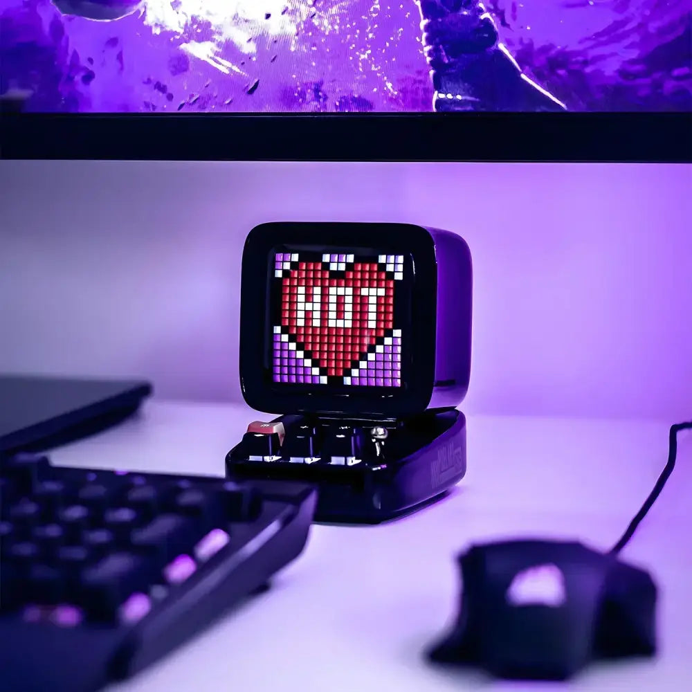 Black retro-style pixel art led display board with red heart and white text on bluetooth alarm clock screen