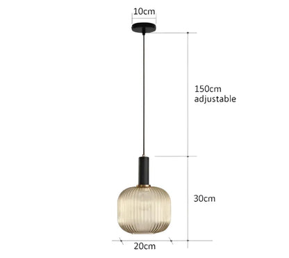 A modern pendant light with a ribbed smoked amber glass globe and black metal hardware for dining room decorbites colorful glass pendant lighting
