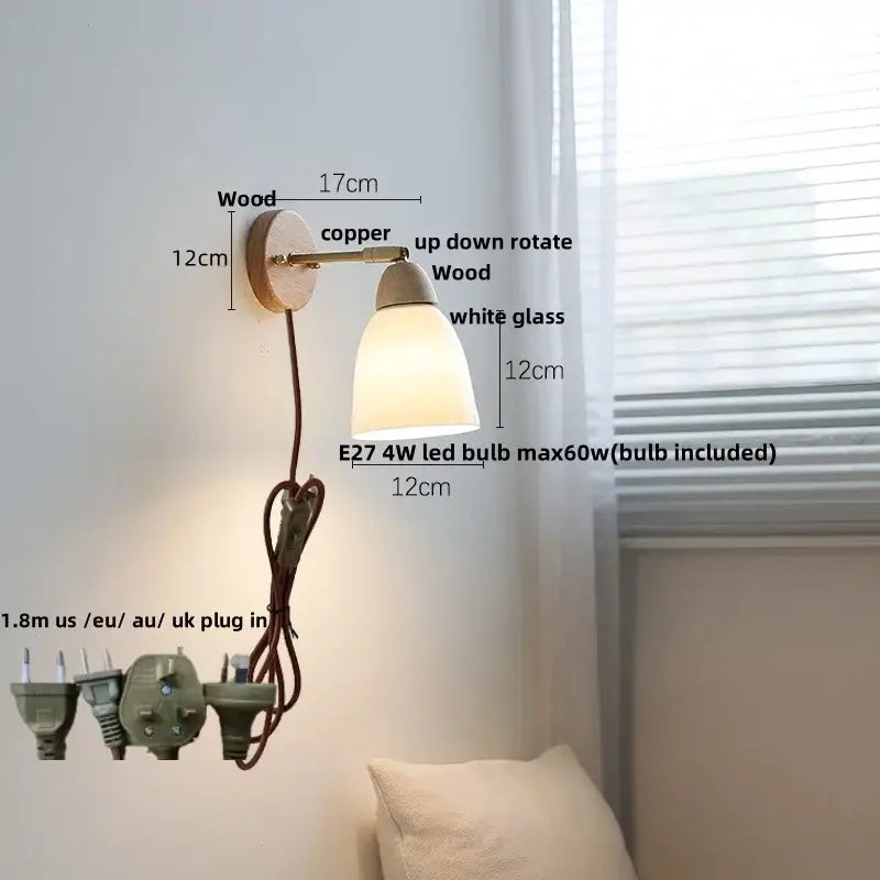 Warm-toned wall sconce light with wooden base copper arm and white glass shade for bedroom use