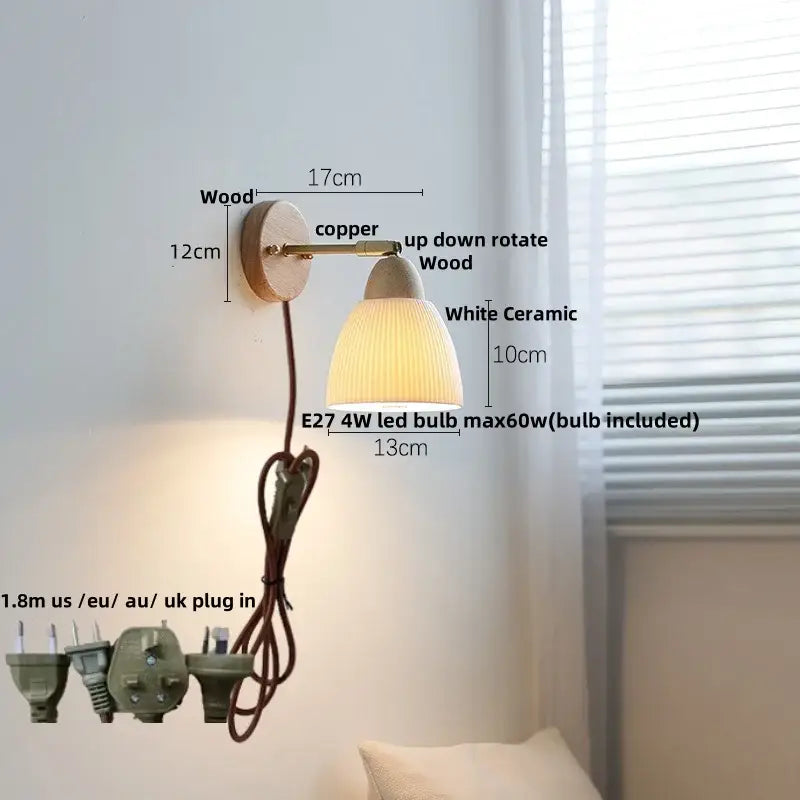 A warm-toned wall sconce light with ribbed white ceramic shade copper arm and wooden base for bedroom use