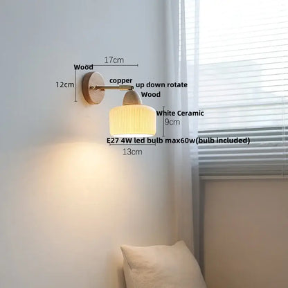 Warm-toned ribbed ceramic and wood wall sconce light with copper arm for bedroom wall sconce fixtures