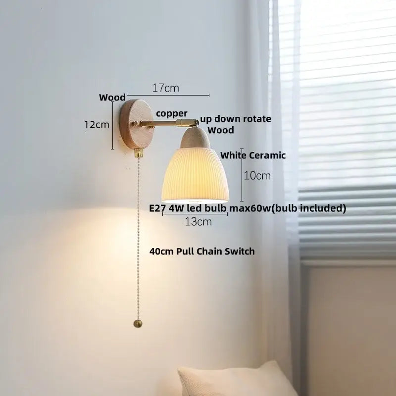A warm-toned wall sconce light with ribbed white ceramic shade, wooden base, and copper arm for bedroom use