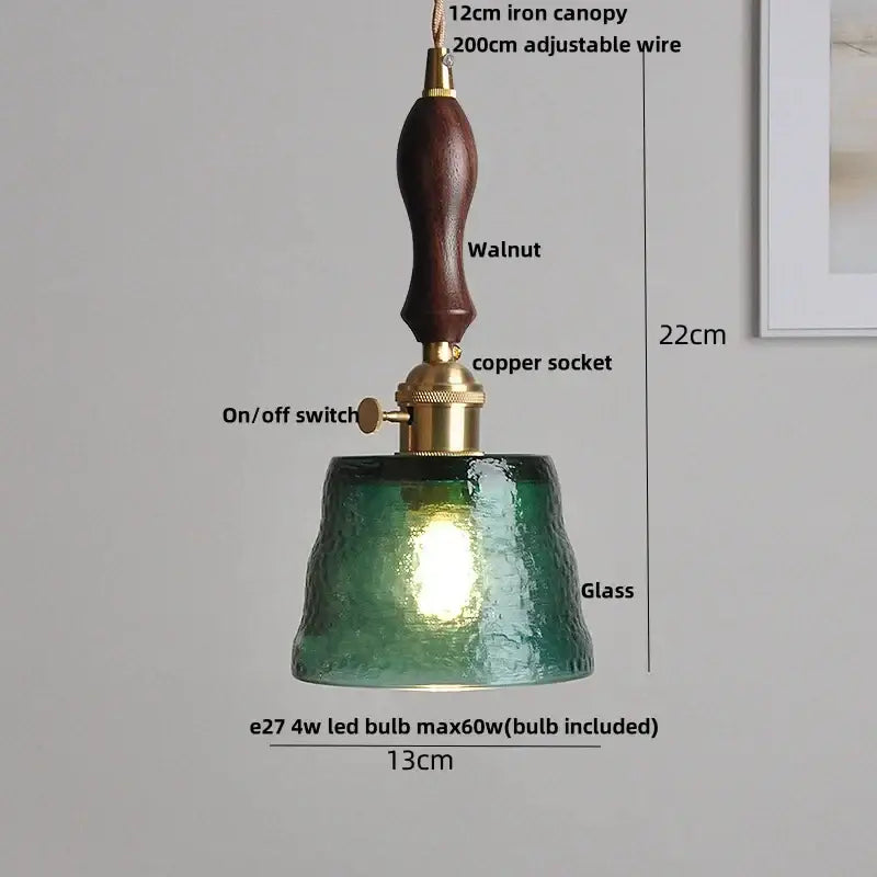 A rustic pendant light with dark walnut handle, brass hardware, and textured green glass shade for dining room decorbites clear glass led