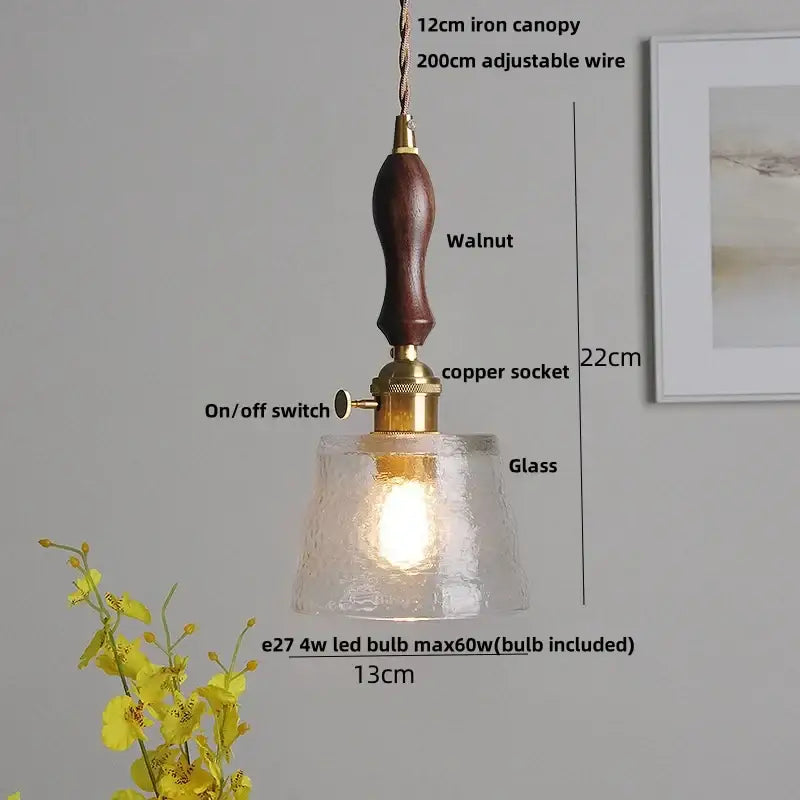 Ribbed clear glass led pendant light with warm tones dark walnut handle and brass accents for dining room decorbites clear glass