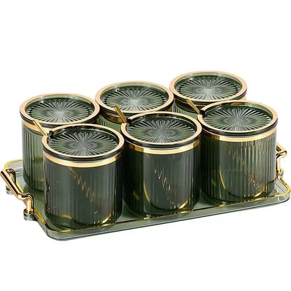 Set of six dark green decorbites acrylic seasoning jars with gold lids on matching tray for kitchen storage