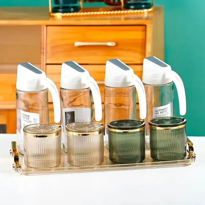 Set of ribbed clear and olive green acrylic seasoning jars with transparent oil dispensers and gold-rimmed lids decorbites acrylic seasoning