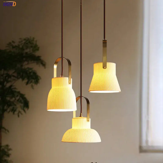 Three ribbed cream ceramic led pendant lights with brass accents hang from dark cords in kitchen decorbites ceramic led pendant design
