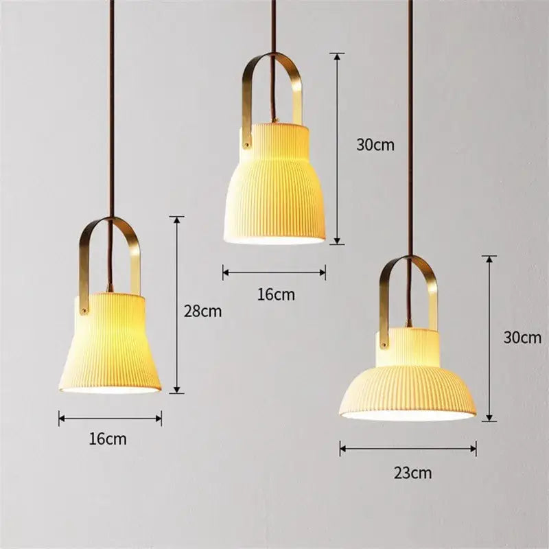 Three modern pendant lights with ribbed warm-toned glass shades and brass frames decorbites ceramic led pendant light