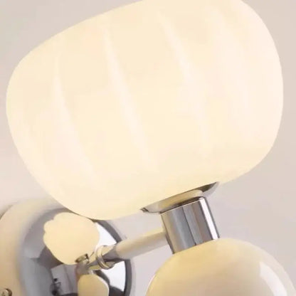 Cream breeze pumpkin wall lamps with ribbed cream-colored glossy glass shade and polished chrome stem for bedroom decorbites lighting