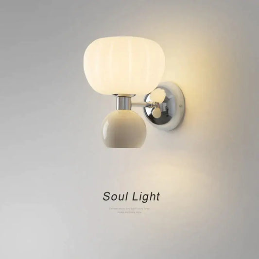 Cream breeze pumpkin wall lamp with ribbed cream-colored glass and chrome mounting bracket for bedroom decorbites lighting