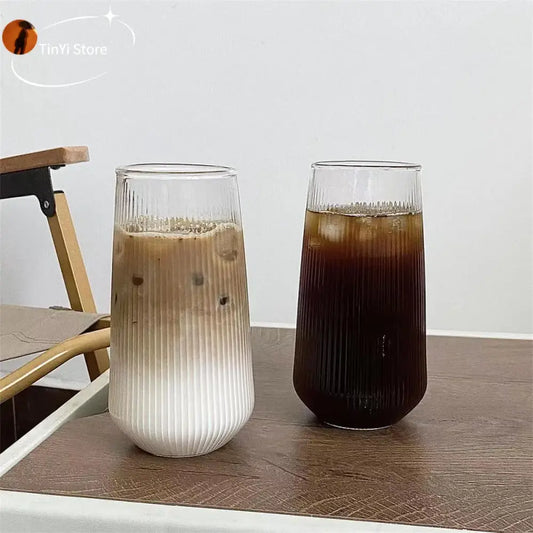 Two tall ribbed glass cups with frosted white lower half and clear upper half from decorbites clear glass coffee set