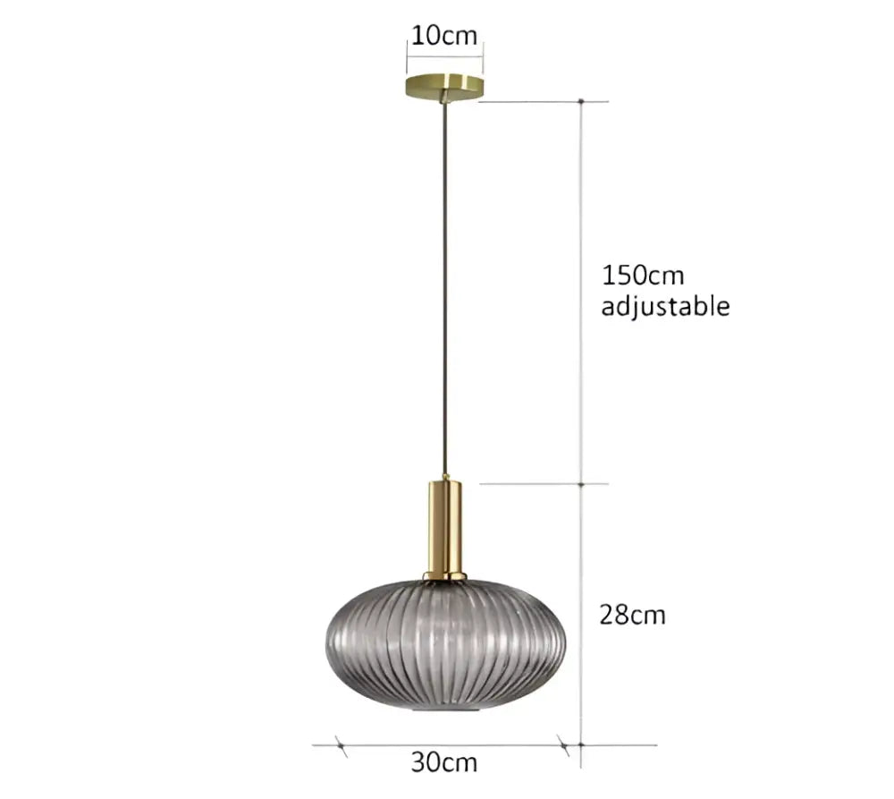 A modern ribbed glass pendant light with a translucent gray shade and brass finish for dining room use
