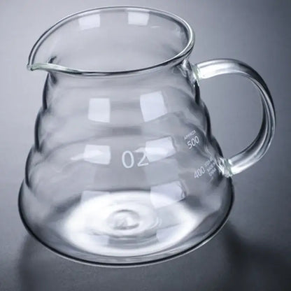 Clear ribbed glass coffee maker pot with curved spout handle and measurement markings for coffee brewing