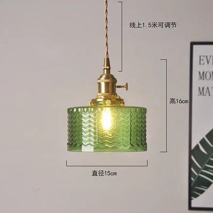 Ribbed green glass pendant light with brass hardware and adjustable cord for bedroom use with textured glass pendant light design