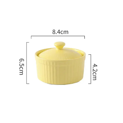 Pale yellow decorbites ceramic dessert bowl with vertical ridges and matching lid for elegant dining use