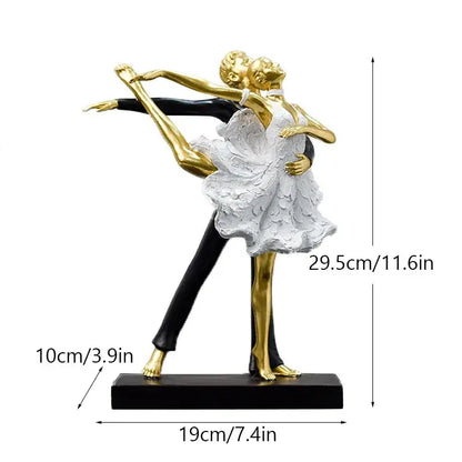 Elegant gold and black decorbites dancing couple sculpture featuring a textured white dress for living room decor