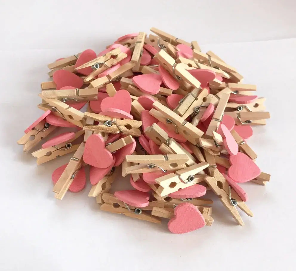 Pink romantic heart shape wood clips with natural wood accents and metal springs for bedroom decor