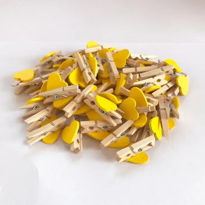 Yellow romantic heart shape wood clips with natural wood bodies and painted yellow clips for bedroom decor