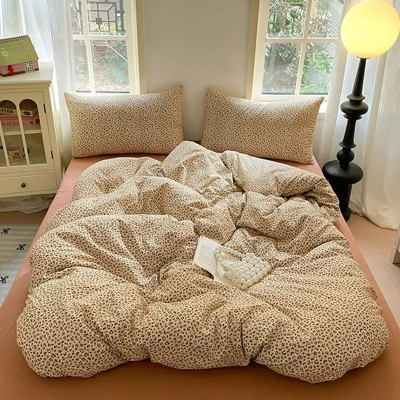 Cream-colored leopard-print bedding set with plush texture and matching pillows from decorbites cotton flower print collection
