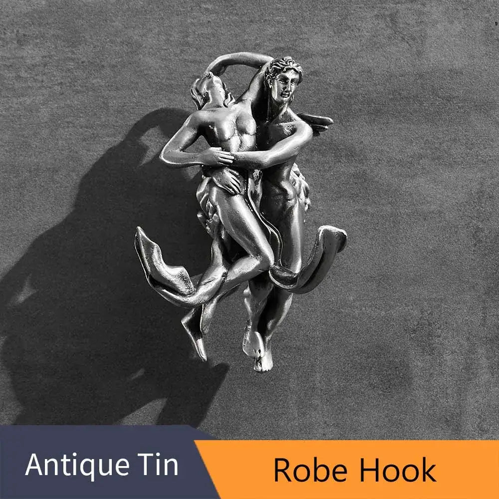 Antique tin robe hook with silver toned sculpture of two embracing figures in romantic silver angel bathroom hardware set