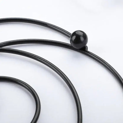 Black leather cord with a glossy black bead for decorbites iron pan pot mat in black and rose gold kitchen coasters