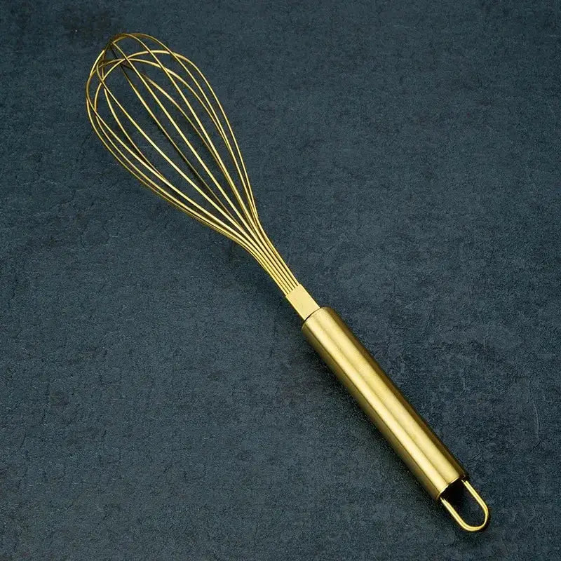 Rose gold and brass steel egg beater whisk with gold steel egg beater and sleek cylindrical handle by decorbites gold steel