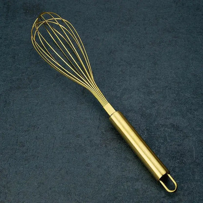 Rose gold and brass steel egg beater whisk with gold steel egg beater and sleek cylindrical handle by decorbites gold steel