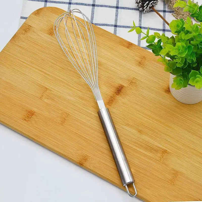 Stainless steel egg beater whisk with sleek cylindrical handle and fine wire loops for decorbites gold steel kitchen use