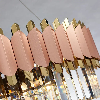 A modern rose gold pendant light with brass leaf plates and e14 led crystal prisms for dining room use