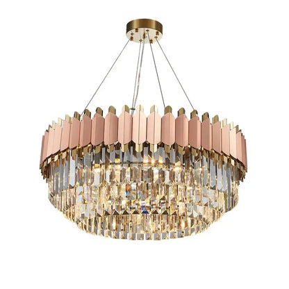 A two-tiered rose gold pendant light with clear e14 led crystal elements and a brass-finished stainless steel mount for dining rooms