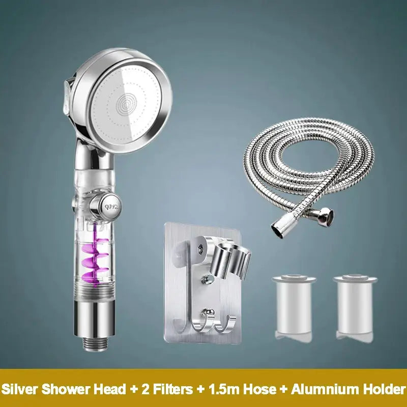 Silver handheld rose gold high pressure shower head with transparent body showing purple spiral filters and chrome accents
