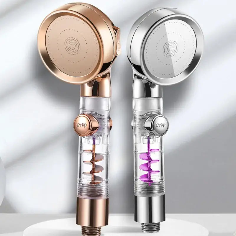 Two modern handheld showerheads in rose gold and chrome with transparent bodies for a high pressure shower experience