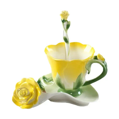 A delicate yellow and green porcelain rose peony floral teacup set with matching saucer and enamel rose peony spoon rest
