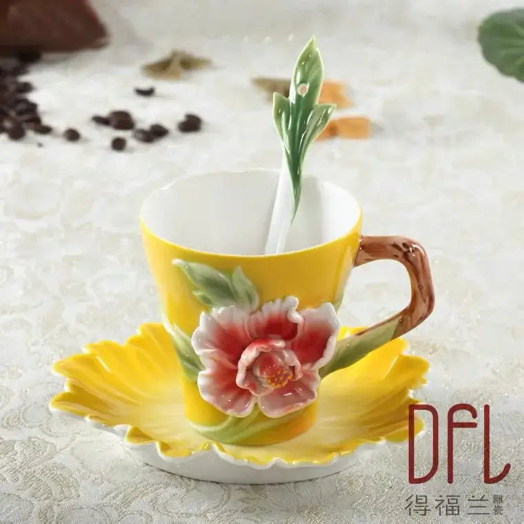 A vibrant yellow ceramic rose peony floral teacup set with sculpted flower design and leaf-shaped matching saucer for dining room
