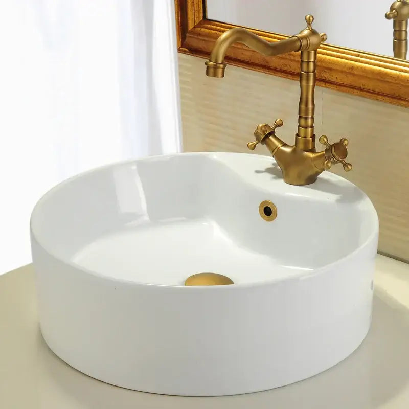 White ceramic vessel sink with vintage brass faucet and decorbites brass sink overflow cover set for kitchen and bathroom
