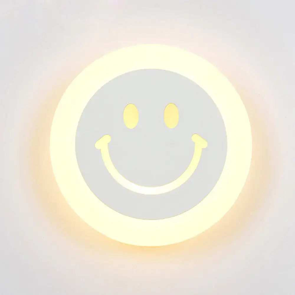 Round led smiley wall sconce with warm white light and soft yellow glow featuring a minimalist gray center design