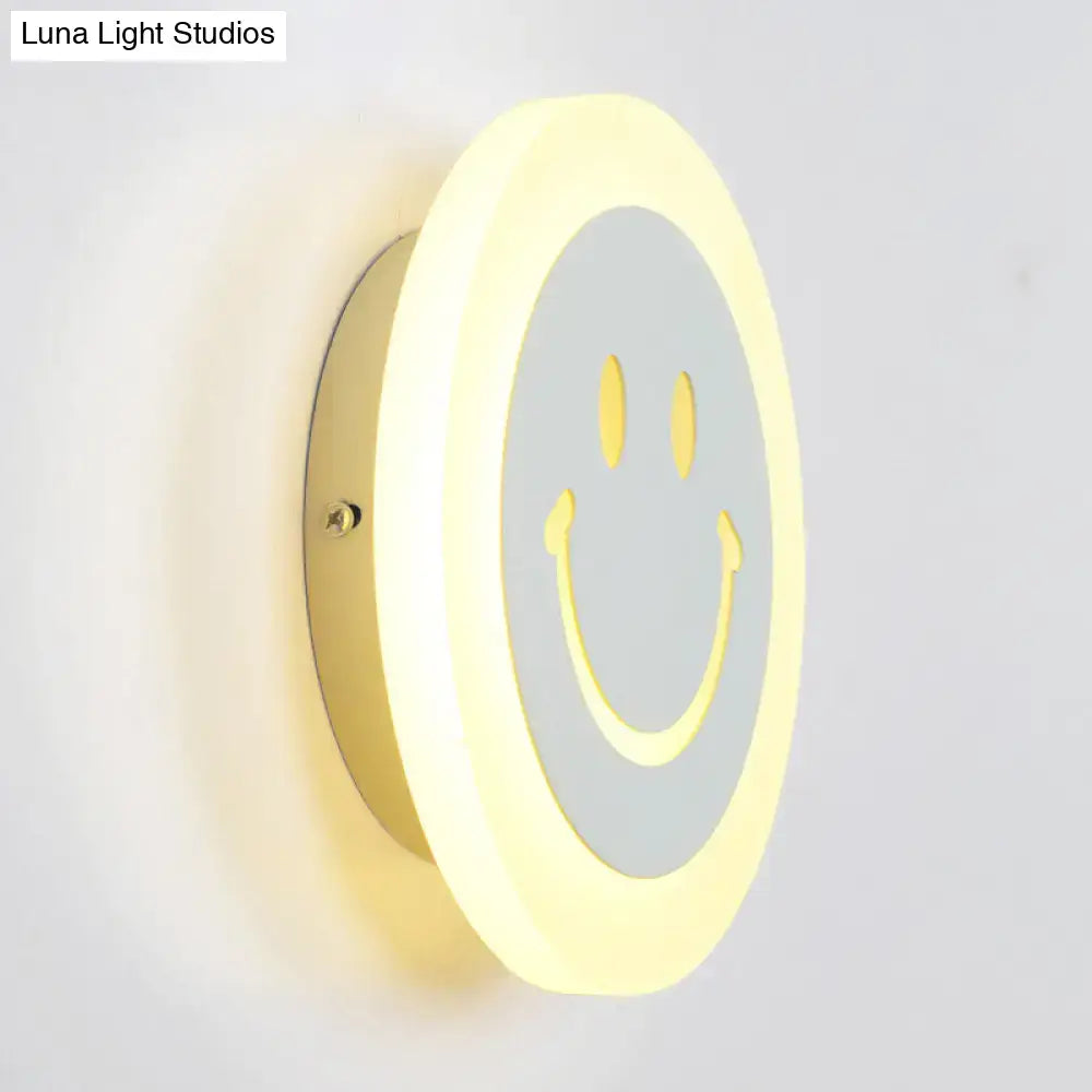 Round led smiley wall sconce with warm white light featuring a gray center and yellow eyes for bedroom decor