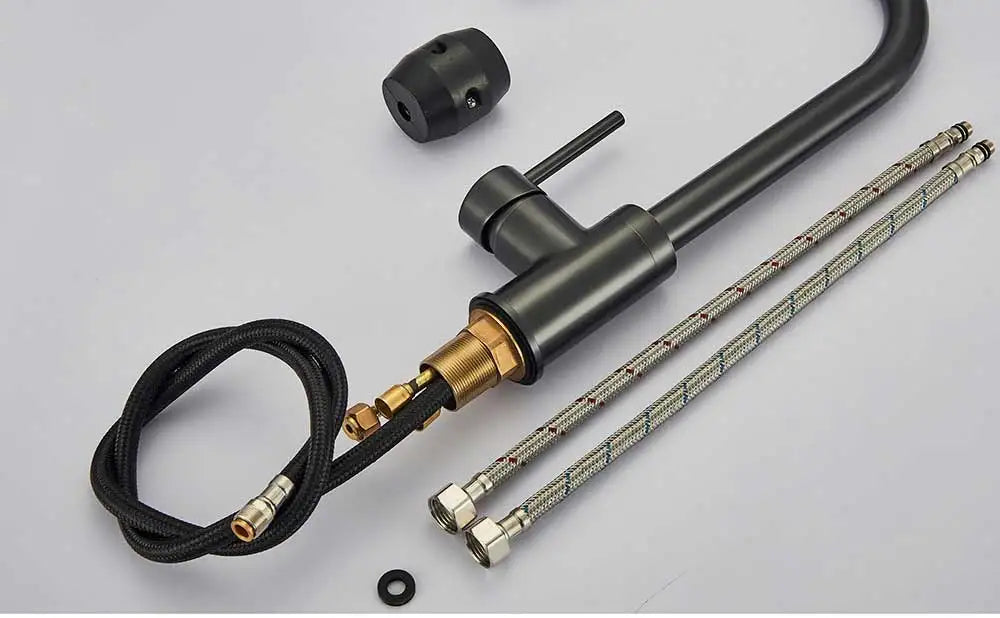 Black matte finish deck mounted single hole kitchen mixer tap with brass accents and flexible braided hoses