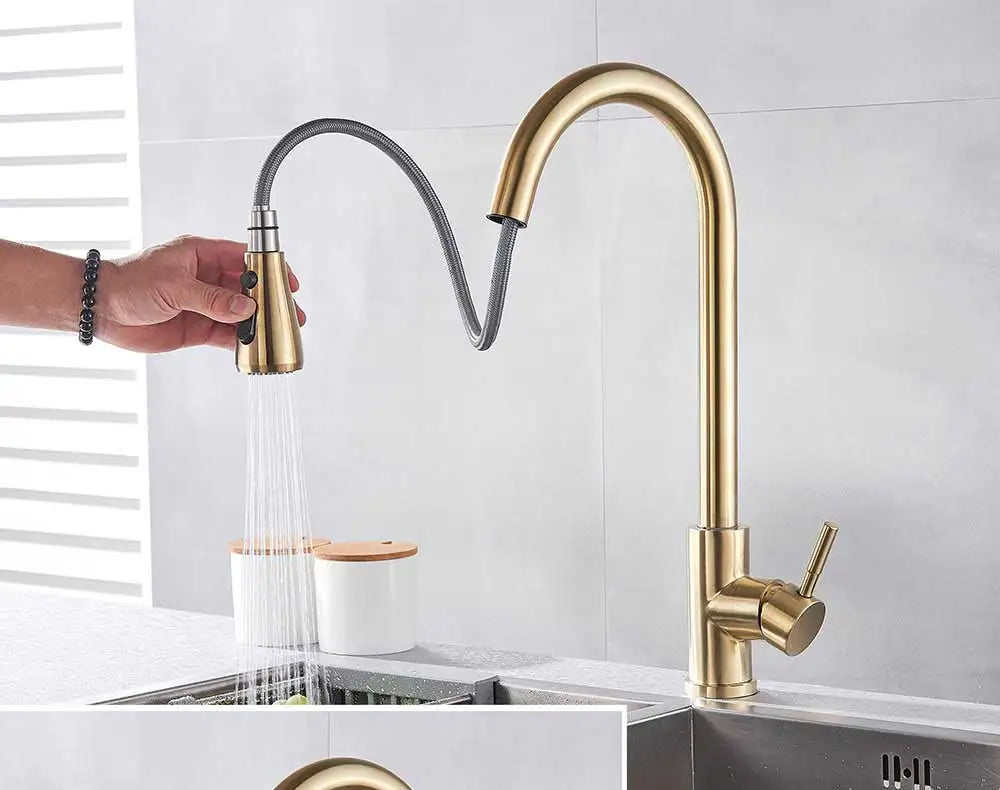 Gold-toned deck mounted Rozin single hole kitchen faucet with flexible curved spout and pull-out spray mixer tap