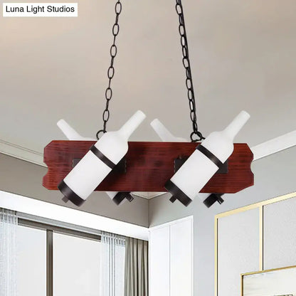 Decorbites island lamp with frosted white wine bottle pendant lights suspended by black chains on brown wood arm base