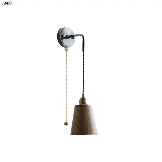 Rustic ash wood led wall light with matte wood shade, brass accents, and adjustable pull chain for bedroom use