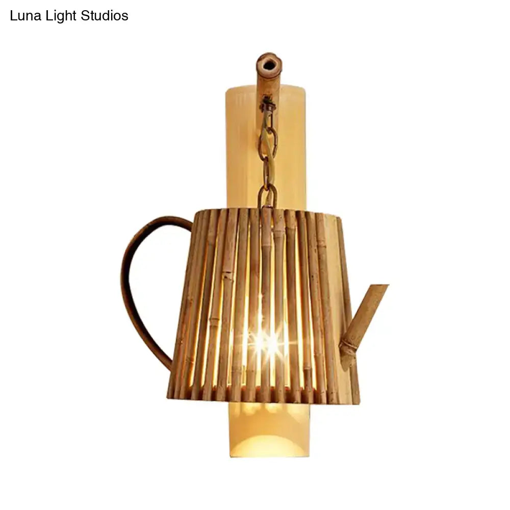 Rustic bamboo cylinder house sconce light fixture shaped like a cylinder house teapot with a warm glowing interior and metal handle