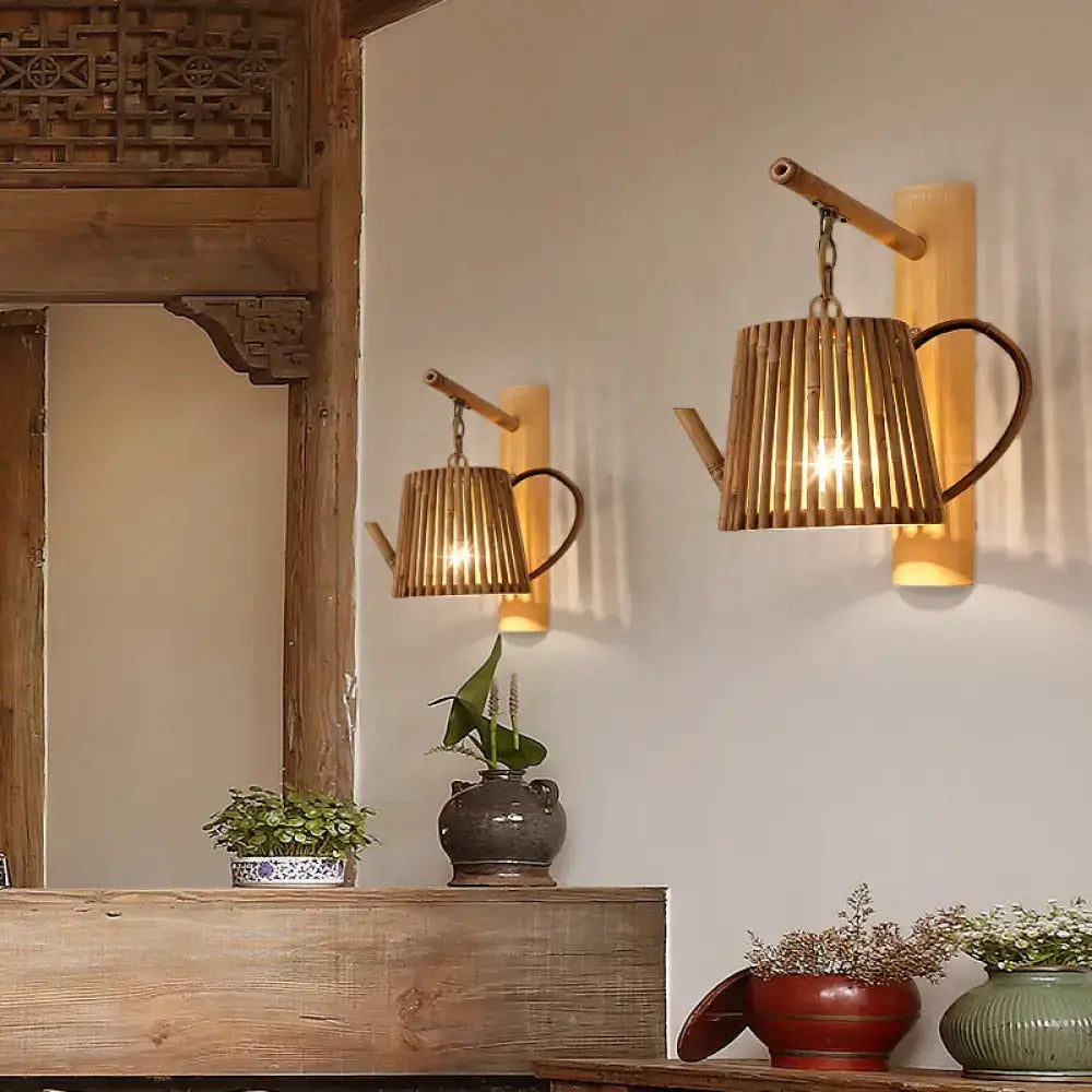 Rustic bamboo cylinder house sconce light fixture with slatted natural wood body and dark metal handle for bedroom wall lamp