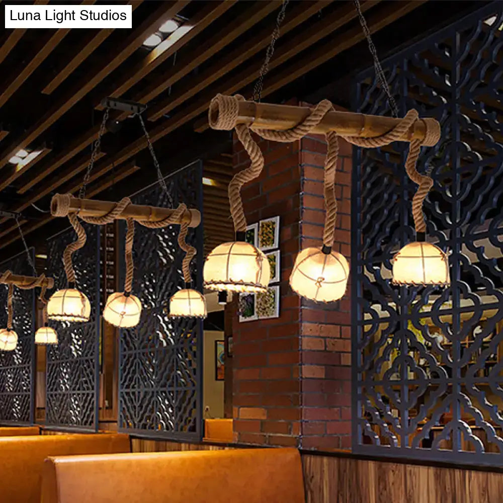 Rustic bamboo linear island pendant light with thick rope accents and beige warm-toned fabric shades for 220v-240v use