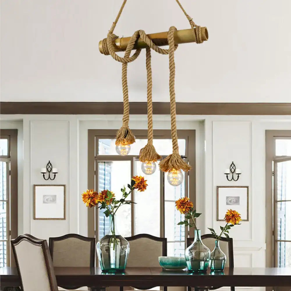 Rustic nautical-style decorbites adjustable rope island light with beige bamboo rod and thick rope suspending three bulbs